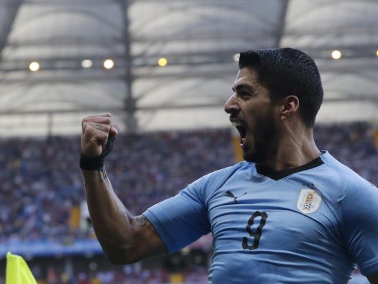 Luis Suarez sends Uruguay through with goal on his 100th appearance