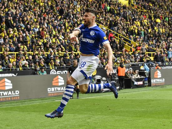 Nine-man Dortmund slump to derby defeat as title hopes fade