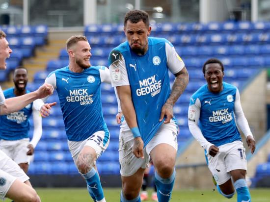 Peterborough promoted after Jonson Clarke-Harris’ late leveller against Lincoln