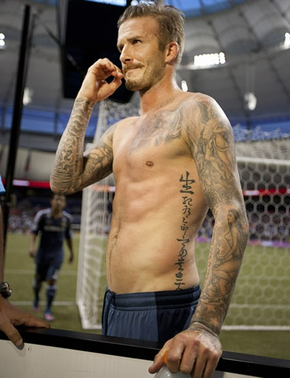 Becks treats fans to topless walkabout - Torso display after saving team from defeat