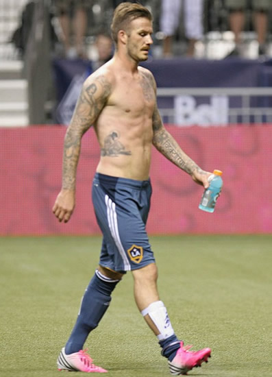 Becks treats fans to topless walkabout - Torso display after saving team from defeat