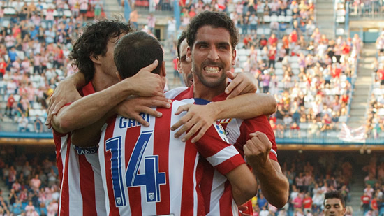 Atletico rout Rayo to maintain perfect start