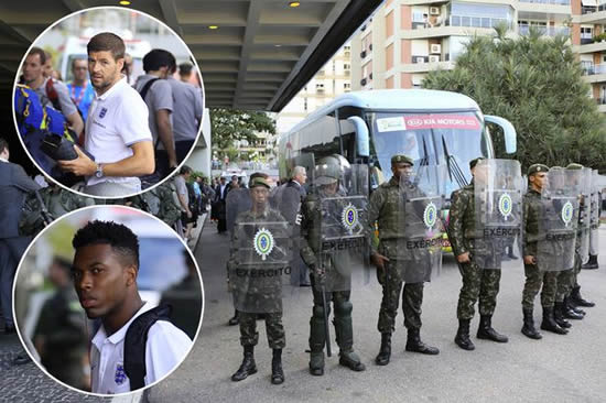 England squad arrive at Rio hotel in Brazil to be greeted by ranks of riot police