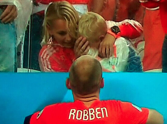 Cute: Arjen Robben consoles crying son with his wife after Holland lose on penalties to Argentina