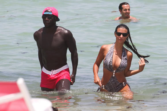 He's still a red! Ex-Arsenal star Bacary Sagna hits Miami with his STUNNING wife Ludivine