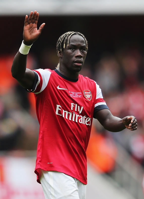 He's still a red! Ex-Arsenal star Bacary Sagna hits Miami with his STUNNING wife Ludivine