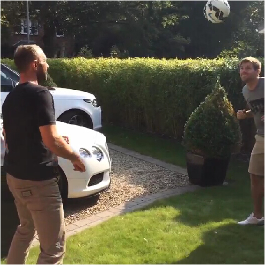 Liverpool’s Steven Gerrard plays keepy-uppy headers next to his white Bentley & Range Rover