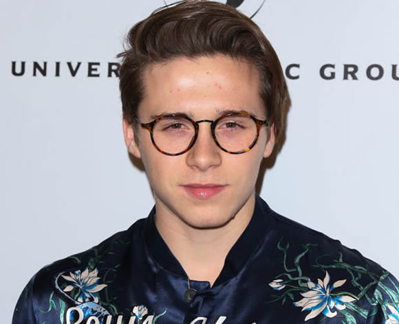Birthday Boy: Brooklyn Beckham wheely happy to try out his dad's cars