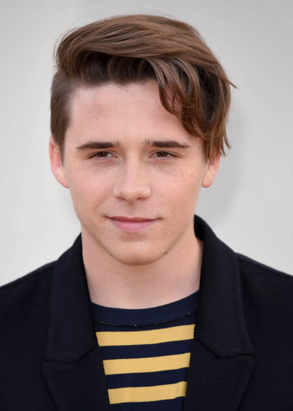 Birthday Boy: Brooklyn Beckham wheely happy to try out his dad's cars