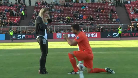 Watch this goalkeeper bring his girlfriend onto the field for a romantic pre-game marriage proposal
