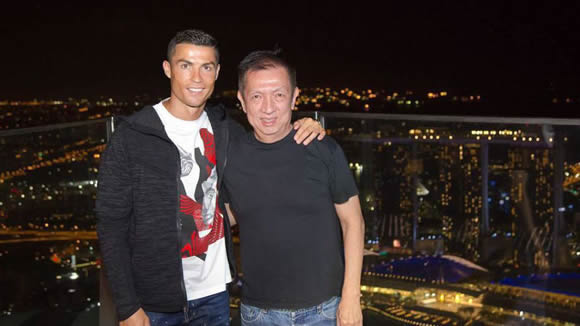 Cristiano Ronaldo with his friend Peter Lim