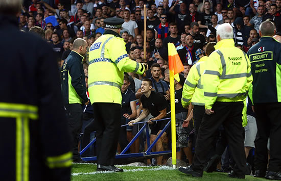 Shocking moment footie hooligans hurl chairs during Everton Europa League match