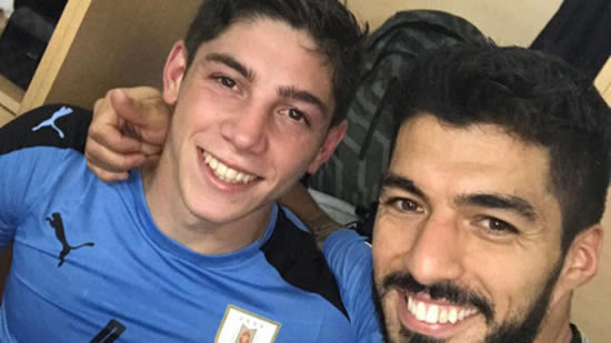 Luis Suarez congratulates Valverde on Uruguay strike