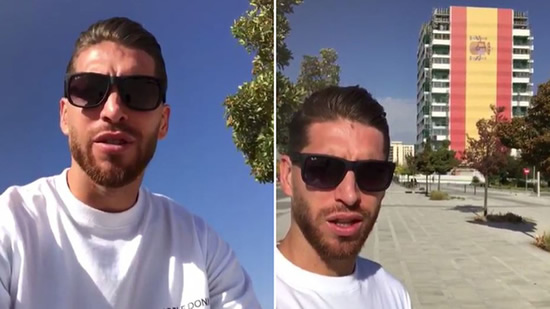 Sergio Ramos is amazed by a huge Spanish flag