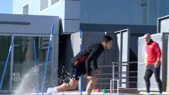 Luis Suarez trains on beach sand to strengthen his knee