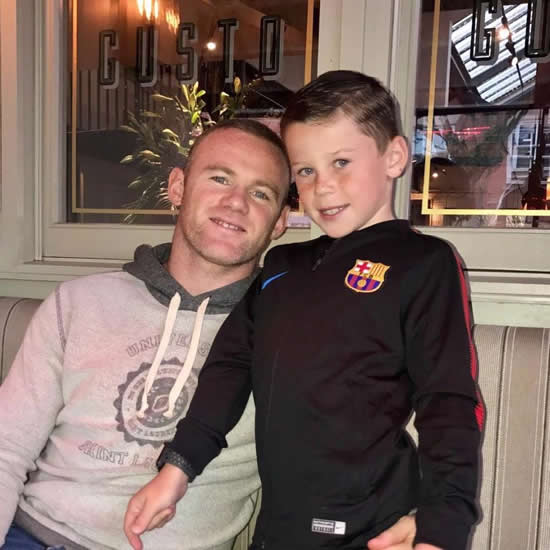 Wayne Rooney's son Kai wears a Barcelona jacket as he poses with Everton star dad