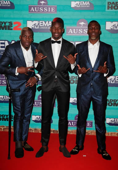 Injured Paul Pogba dances with his brothers at MTV's Europe Music Awards while Dele Alli dresses down for the big night