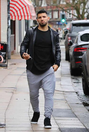 Manchester City star Sergio Aguero heads out for lunch while Liverpool's Mohamed Salah goes for coffee up the road in Cheshire