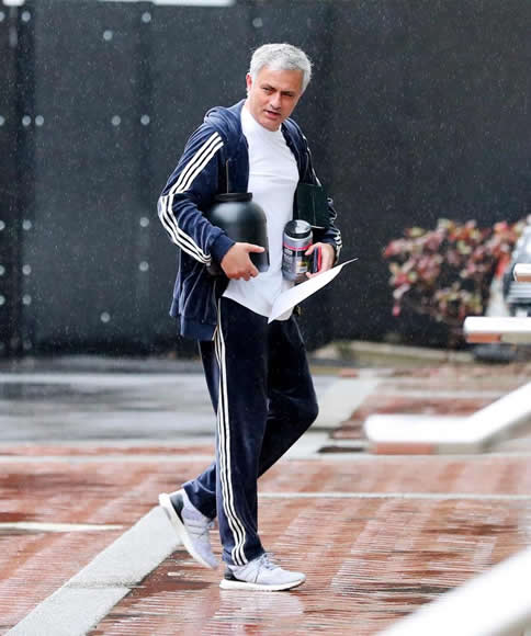Manchester United manager Jose Mourinho carries tubs of protein into Lowry ahead of Man City clash