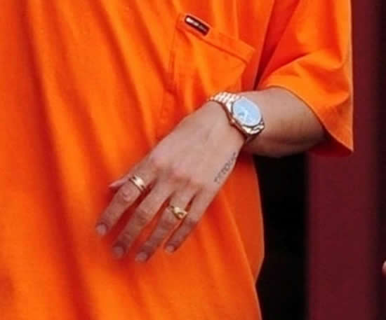 Arsenal star Hector Bellerin shows off luxury watch and rings in striking orange outfit while out in London sun