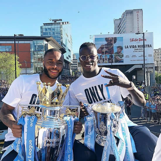 Benjamin Mendy runs around topless as thousands turn out for Man City Premier League title parade in Manchester city centre