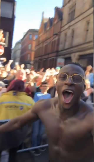 Benjamin Mendy runs around topless as thousands turn out for Man City Premier League title parade in Manchester city centre