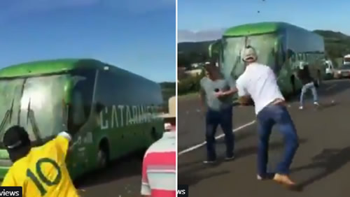 Brazil Fans 'Welcome Back' Players By Throwing Stones At Team Bus