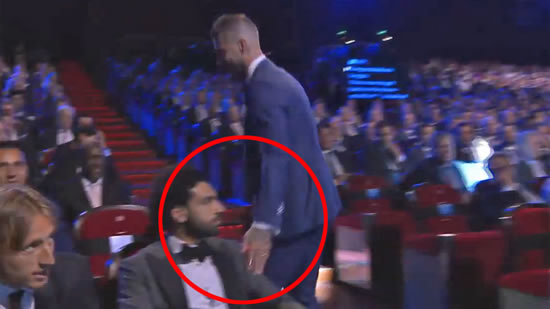 Sergio Ramos caressed the left shoulder of Salah