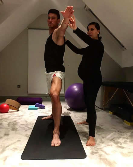 Arsenal star Laurent Koscielny practices his yoga as part of rehab from ruptured Achilles
