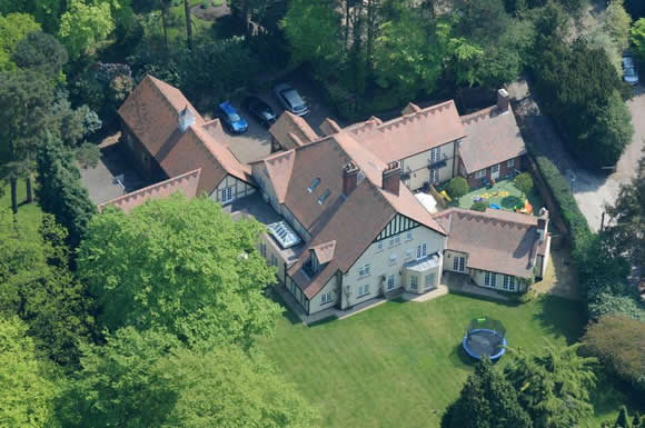 Footie legend Rio Ferdinand has knocked a staggering £2.5 MILLION off the original price of the house he once shared with his late wife and mother to his children Rebecca