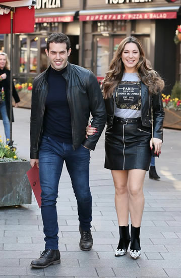Kelly Brook flaunts legs in thigh-skimming leather miniskirt