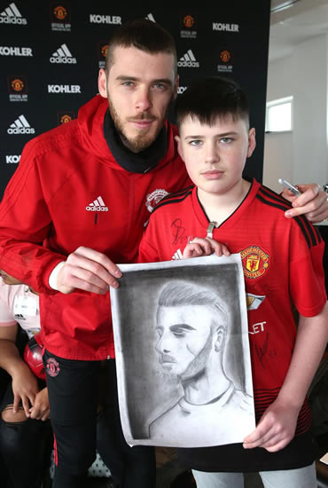 David De Gea and Paul Pogba put transfer talk to one side to receive portraits drawn by kids on Man Utd's 'Dream Day