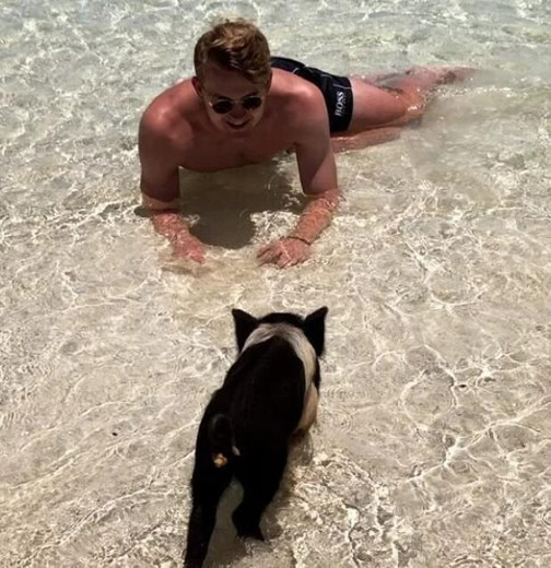 Matthijs de Ligt and Wag AnneKee Molenaar play with pigs on Bahamas beach as Ajax kid nears Juventus transfer