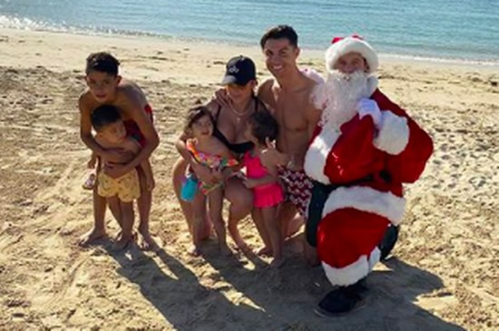 Cristiano Ronaldo poses for cute Christmas snap with WAG Georgina Rodriguez and Santa