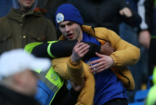 Cardiff fans in bust-up with stewards and security guards in Swansea clash as South Wales derby heats up