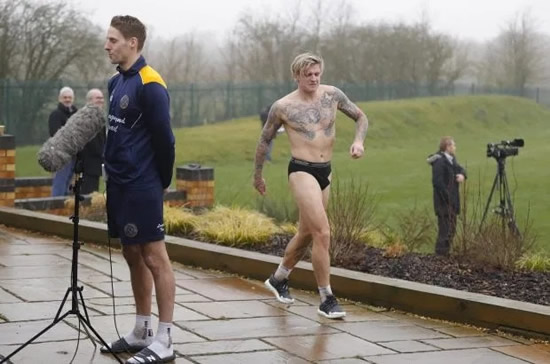 SHREW BEAUTY Sky Sports News viewers in hysterics as Shrewsbury ace Jason Cummings walks past camera during live interview naked