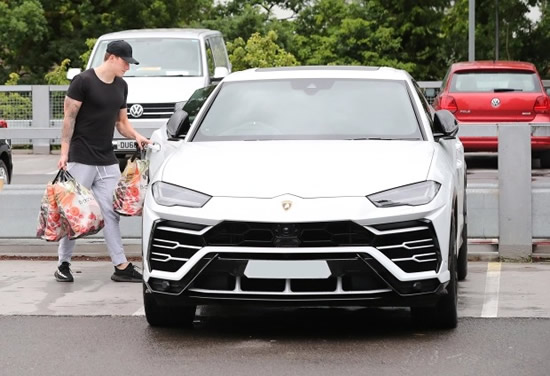 BIT OF ALL WHITE Man Utd star Jones has yellow wrap taken off £160,000 Lamborghini Urus as he puts car up for sale