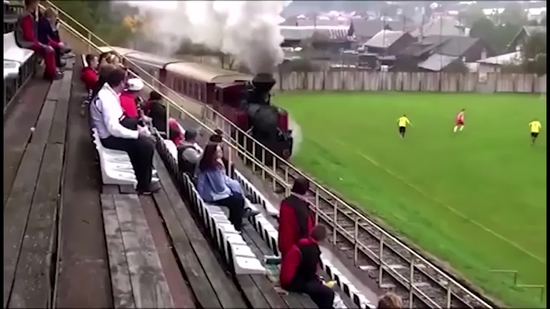 Unbelievable scenes as a train passes through a football pitch!