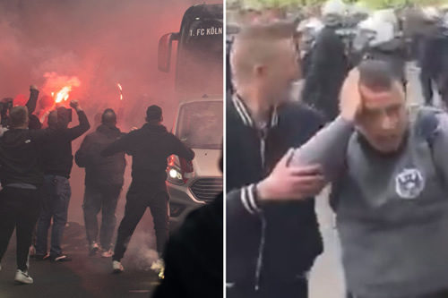 Watch riot police scramble to control raging Koln fans as thousands let off flares and throw bottles leading to arrests