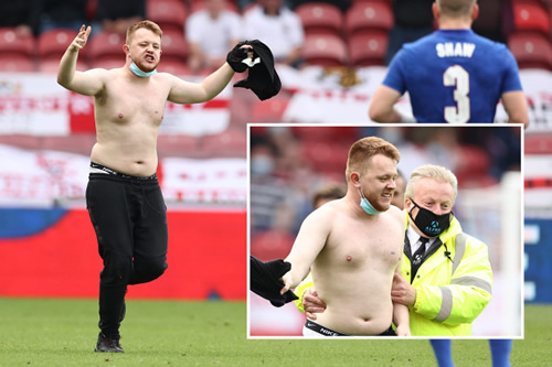England vs Romania halted by topless pitch invader as TV commentators apologise for fans shouting ‘you fat b******’