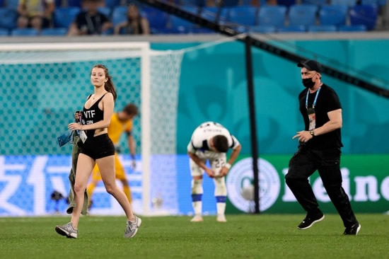 Euro 2020 pitch invader advertises cryptocurrency in skimpy outfit during Belgium's clash with Finland