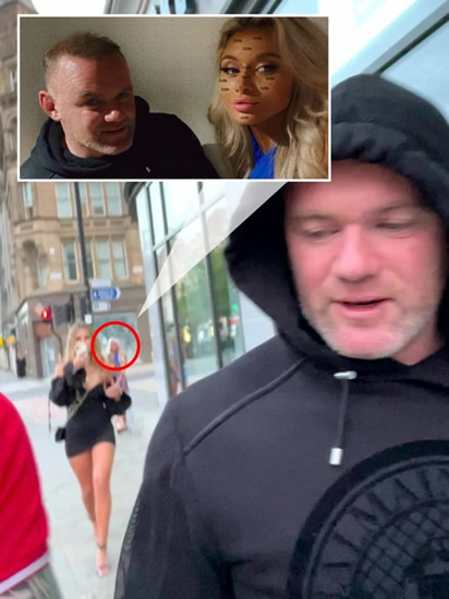 Wayne Rooney filmed walking two blondes back to budget hotel minutes before viral pictures of him asleep were taken