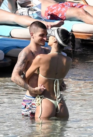 Marco Verratti kisses and cuddles model wife Jessica Aidi on honeymoon as loved-up pair enjoy steamy trip to the beach
