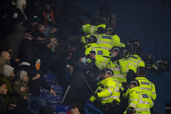 Legia Warsaw thugs punch police and target Leicester fans in violent scenes