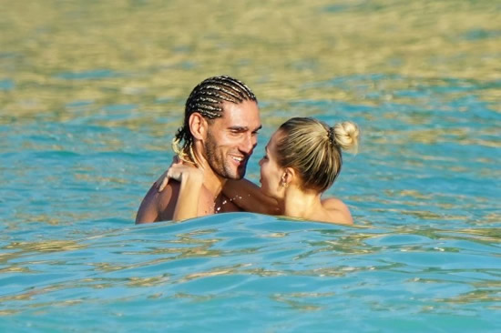 LUCKY FELLA Ex-Man Utd star Fellaini kisses stunning Russian artist Victoria Alex in the sea on holiday in St Barts