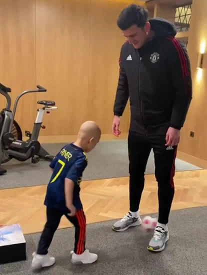 HAPPY HARRY Man Utd captain Harry Maguire has kickabout with ‘legend’ River Rhodes as young child battles cancer