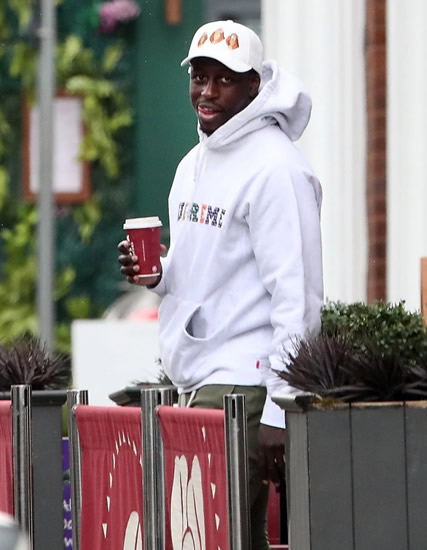 COFFEE BREAK Manchester City star Benjamin Mendy spotted enjoying coffee with pals as he awaits trial for seven counts of rape