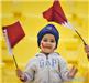 A Qatari child cheers for the team before the 2011 Asian Cup quarter-final football match between Qatar and Japan in Doha, capital of Qatar, Jan. 21, 2011. 