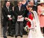 Abbey days ... thrilled sir Elton John and partner David Furnish watch couple walk past during wedding ceremony