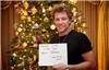 Sign of life ... Jon Bon Jovi holds up message confirming he is alive